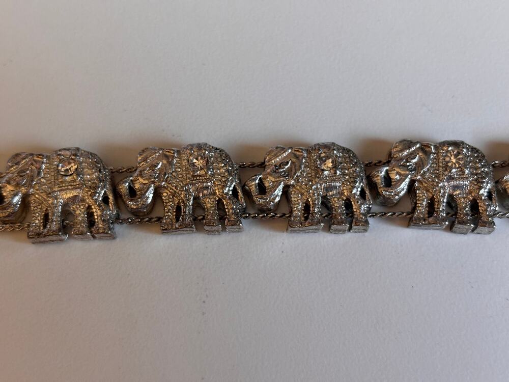 Silvertone elephant Link bracelet with Green, pink gold, and blue swirls